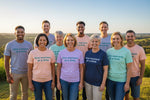 "One Moment at a Time" suicide prevention and mental health awareness t-shirt, offering a message of hope and support. From Wear What You Stand For Products.